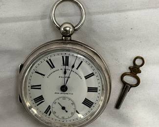Silver-Colored Manual Wind Pocket Watch with Key, Roman Numerals, and Engraved Case