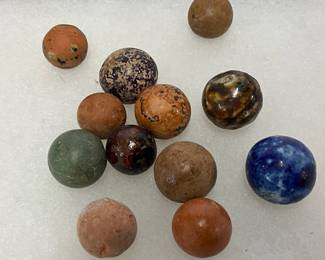 Early 1900s Clay, Glass, and Ceramic Marbles with Varied Colors