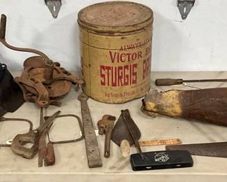 Early Tools with Horse Collar, Saw, and Sturgis Baking Powder Tin
