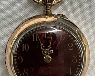 Swiss-Made Open-Face Pocket Watch With Ornate Back Engraving And Visible Movement