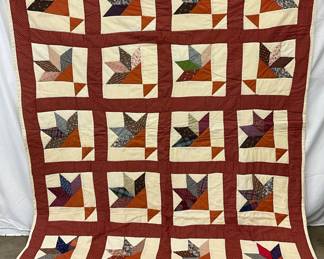 Handmade Patchwork Quilt with Leaf Motif and Red Border