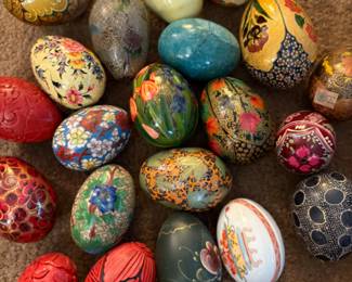 a large selection of stone and paper mache eggs