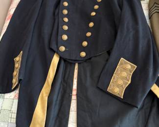 antique military items, including an 1880s US Navy dress tailcoat, epaulets, patches, and other jackets and headgear
