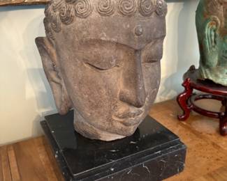 antique stone head of Buddha