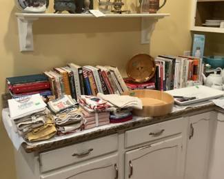 Kitchen linens, cookbooks, wooden salad bowl and other collectibles