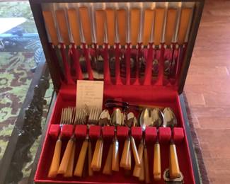 Full set of twelve Butterscotch Bakelite flatware.  Plus other sets of steak knives and a bag of several patterns of butterscotch.