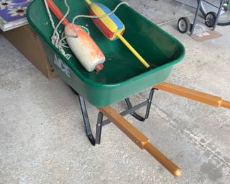 Wheelbarrow and vintage buoys.