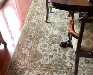 Beautiful rug in green and tan.  Measures 10.5 l x 8’. Presale $350