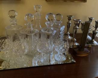Decanters and glasses.  Also candlesticks…larger one are weighted silver.  Gotham.