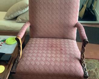 Burgundy chair with wood trimmed arms…measures 30 w x 31” d x 43” h.