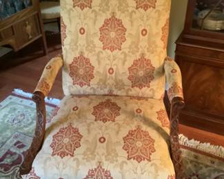 Patterned chair of deep red and off white with wood trim.  Measures 29” w x 26” d x 42” h.presale $150