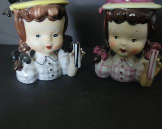 These are vases and they are adorable. I also have some lady ones.