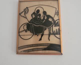 This is a reverse glass silhouette painting from around the 30s. I have several as well as a lot of framed art.