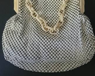 This is a purse by Whiting in the 40s. I have several vintage purses, Neccessaries and hats, as well as compacts and grooming sets.