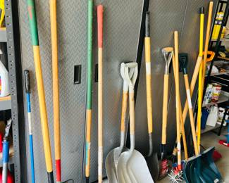 Heavy duty Gladiator garage cabinets, yard tools, shovels