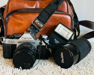 Canon AE-1 program camera with accessories and bag