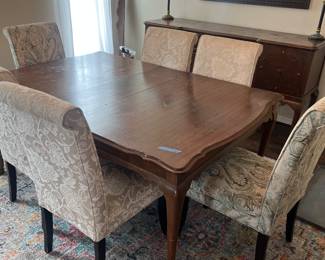 dining table and upholstered chairs
