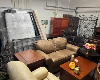 Sofa, baker’s rack, barstool, Lazyboy office chair, rolling storage bins with trays, twin bed, Queen bed with linen headboard