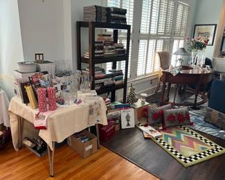 Books, misc serving pieces, Mackenzie-Childs rug, vase, rabbit, pillows