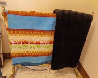 Wedding gift 57 years ago. blanket from Italy, never used.  Fur throw to use when traveling around town in one of our vintage convertibles when it gets nippy!