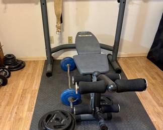 Body Champ Weight Bench and Press Rack. Assortment of Weights and Workout Equipment.
