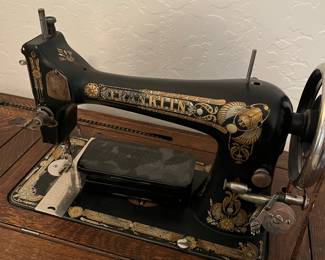 Antique Franklin treadle sewing machine and cabinet