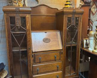 Antique English oak secretary desk with leaded glass bookcase, also known as drop-front desk or bureau
