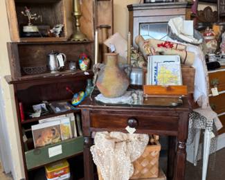 Solid wood end table, large brass candlesticks, pottery, books