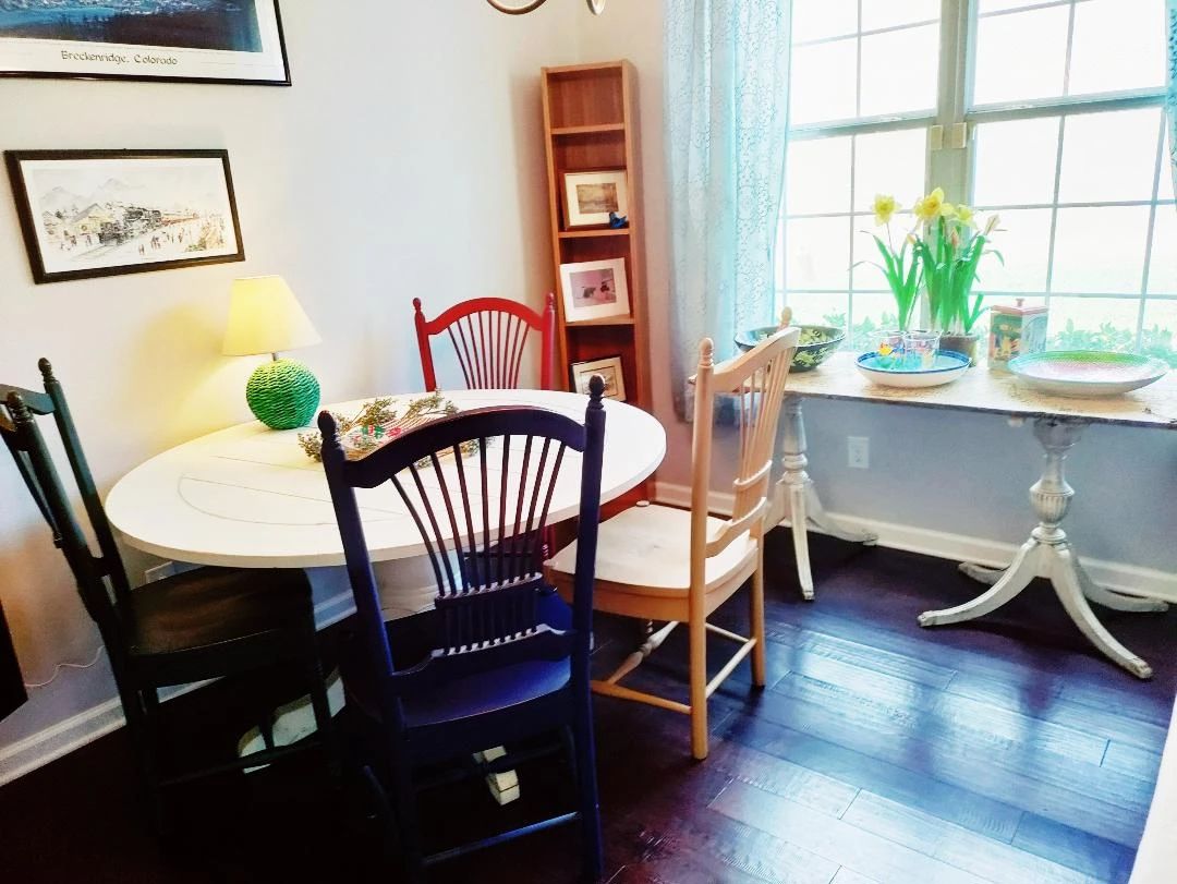 GREAT FARMHOUSE 46" ROUND SOLID WOOD GATE LEG TABLE WITH 4 LADDER BACK CHAIRS IN DIFFERENT COLORS - VINTAGE DOOR MADE INTO A TABLE (BY WINDOW)