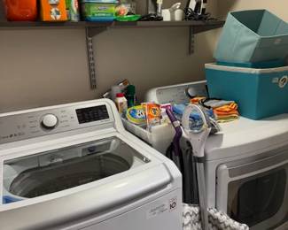 LG washer and dryer, cloth baskets, cleaning supplies, vacuums