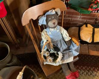 Bear doll in child’s rocking chair