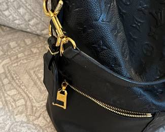 Louis Vuitton
Melie Handbag Monogram Empreinte Leather- Like NEW! Only carried once.