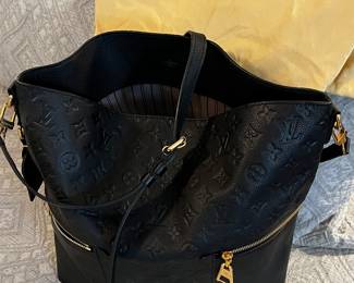 Louis Vuitton
Melie Handbag Monogram Empreinte Leather- Like NEW! Only carried once.