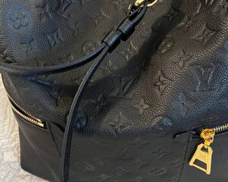 Louis Vuitton
Melie Handbag Monogram Empreinte Leather- Like NEW! Only carried once.