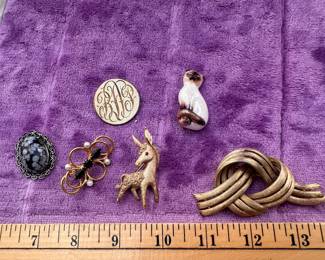 6 Brooches $14.00