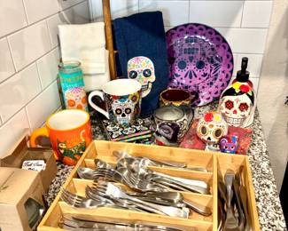 Bamboo drawer organizer, flatware, Dia de los muertos mugs, candle, towels etc.