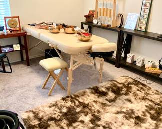 Massage table, rug, healing sounds: chimes, singing bowls, gongs, tuning forks
