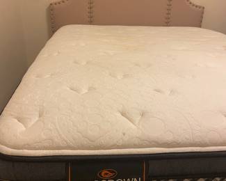One of three Queen mattresses with headboard