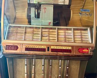 Seeburg Vintage Jute-box with 45 record 
35”w x 26”d x 58”h $2000