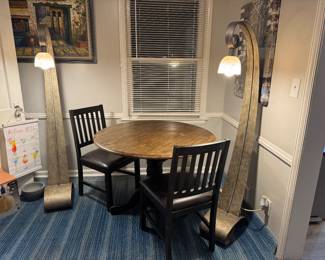 Postmodern steel floor lamps l$75 apiece.
Drop leaf.table with two chairs $125