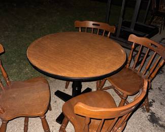 Round table with cast-iron pedestal. The chairs go with. $75.
