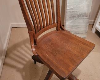 Wood swivel banker chair on wheels