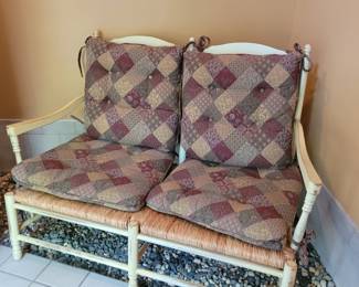 All wood two seater bench with caned seats