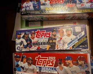 This is a fantastic opportunity for any baseball fan or card collector to get a complete, factory-sealed set of Topps baseball cards. Each box contains every base card from the Series 1 and Series 2 releases of the specified year, making them a perfect way to own a complete collection of that season's top stars and key rookies. These sets are ideal for a hobbyist, a fan who wants to follow their favorite players, or a gift for a young baseball enthusiast.