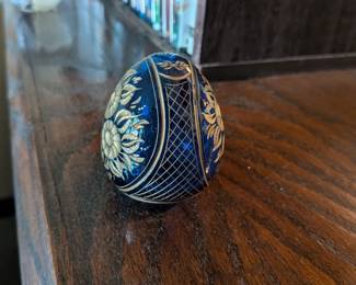 A beautiful and comprehensive collection of seven decorative glass eggs in the classic Fabergé style. Handcrafted in Russia, these eggs feature intricate etched designs in a variety of vibrant colors. They are perfect for a curio cabinet, as unique decorative pieces, or as a gift for a collector of classic Russian art.