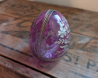 A beautiful and comprehensive collection of seven decorative glass eggs in the classic Fabergé style. Handcrafted in Russia, these eggs feature intricate etched designs in a variety of vibrant colors. They are perfect for a curio cabinet, as unique decorative pieces, or as a gift for a collector of classic Russian art.