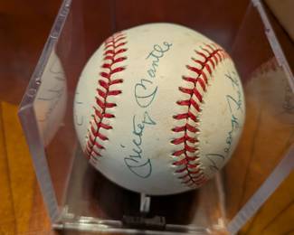 An extraordinary piece of baseball history! This official league baseball is a must-have for a serious collector, featuring the signatures of two Hall of Famers, Mickey Mantle and Whitey Ford, as well as baseball legends Johnny Mize, Bobby Richardson, Tony Kubek, George Foster, and Bobby Brown. This multi-signed ball is a rare and highly desirable collectible, a true centerpiece for any sports memorabilia collection.