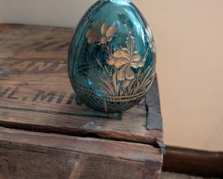 A beautiful and comprehensive collection of seven decorative glass eggs in the classic Fabergé style. Handcrafted in Russia, these eggs feature intricate etched designs in a variety of vibrant colors. They are perfect for a curio cabinet, as unique decorative pieces, or as a gift for a collector of classic Russian art.
