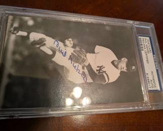 A great piece of New York Yankees history! This small, card-sized photo or postcard features an authentic, hand-signed autograph from Yankees legend and broadcaster Tony Kubek. The signature has been professionally authenticated and certified by PSA/DNA, one of the most respected names in the hobby. It's a great, ready-to-display piece for any Yankees fan or collector of certified sports memorabilia.
