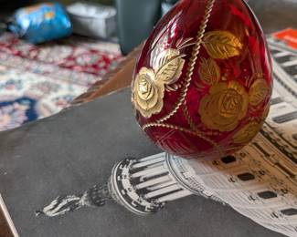 A beautiful and comprehensive collection of seven decorative glass eggs in the classic Fabergé style. Handcrafted in Russia, these eggs feature intricate etched designs in a variety of vibrant colors. They are perfect for a curio cabinet, as unique decorative pieces, or as a gift for a collector of classic Russian art.